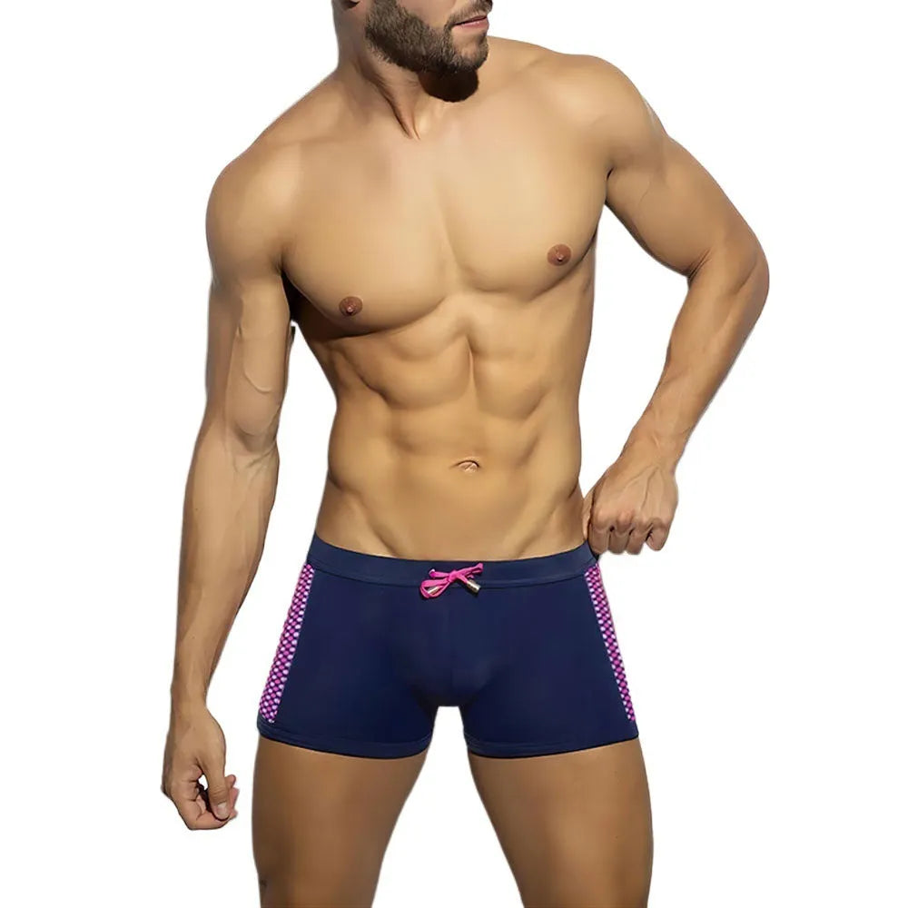 Men's polka dot print quick-drying swimming boxers in nylon fabric on a size chart.