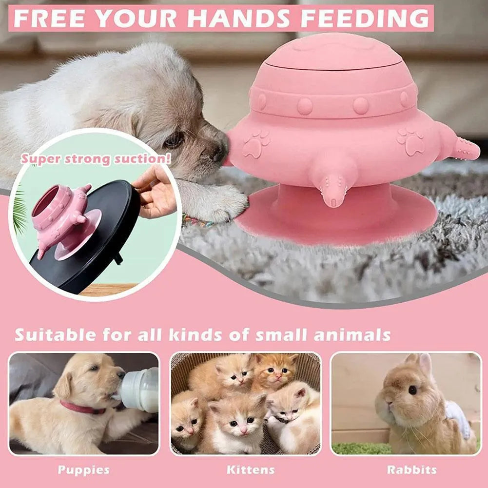 Pink silicone pet nursing milk bowl with four attached pacifiers on a flat base.
