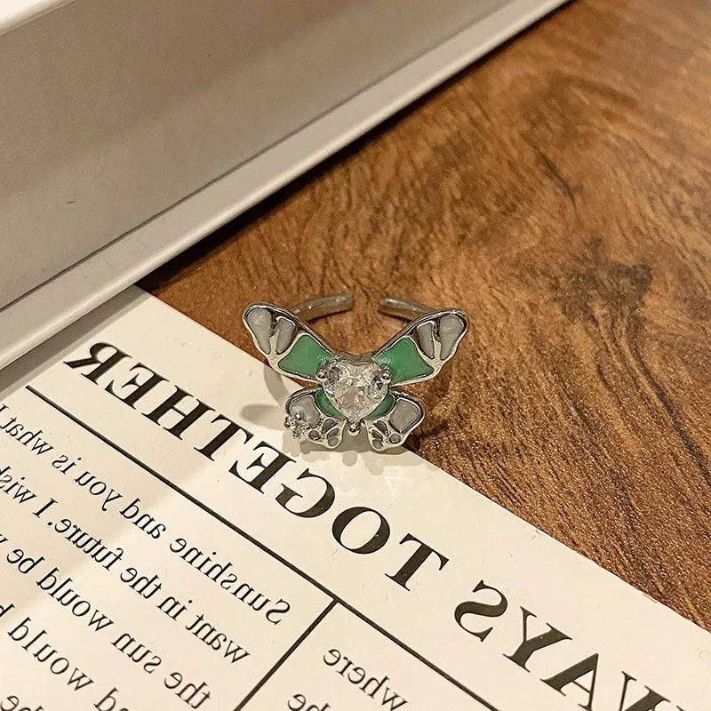 Butterfly design copper ring with oil-drip textured finish in women's jewellery