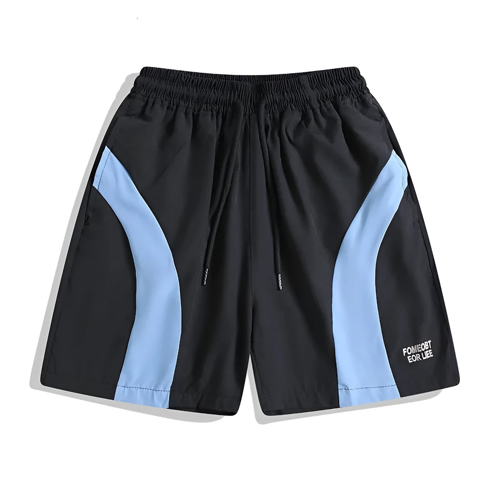 Man wearing loose black quick-drying sports shorts with an elastic waist for training.