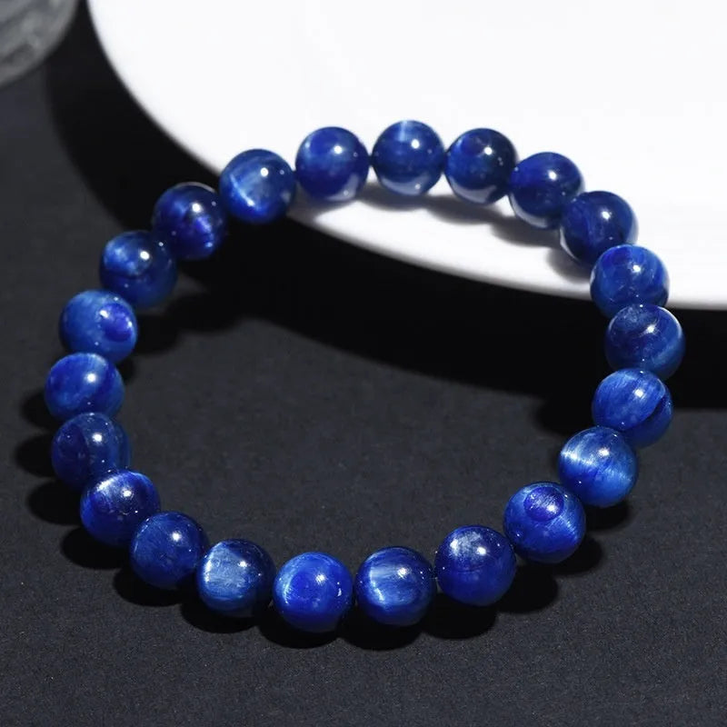 A blue crystal ball bracelet with a geometric shape and traditional Ruyi design elements.