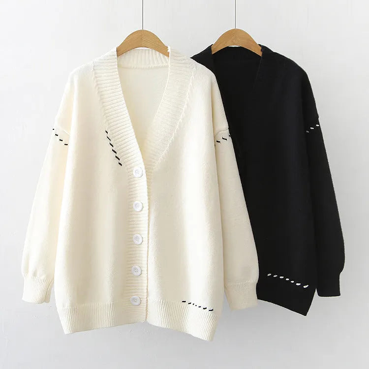 Women's knitted cardigan top coat in black solid colour with long sleeves and loose fit