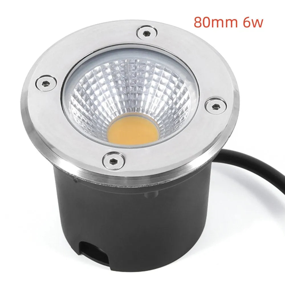 Black round LED COB underground light for outdoor garden and pathway illumination.