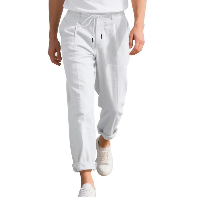 Men's loose-fit straight-leg linen trousers in light khaki colour with a drawstring waist.