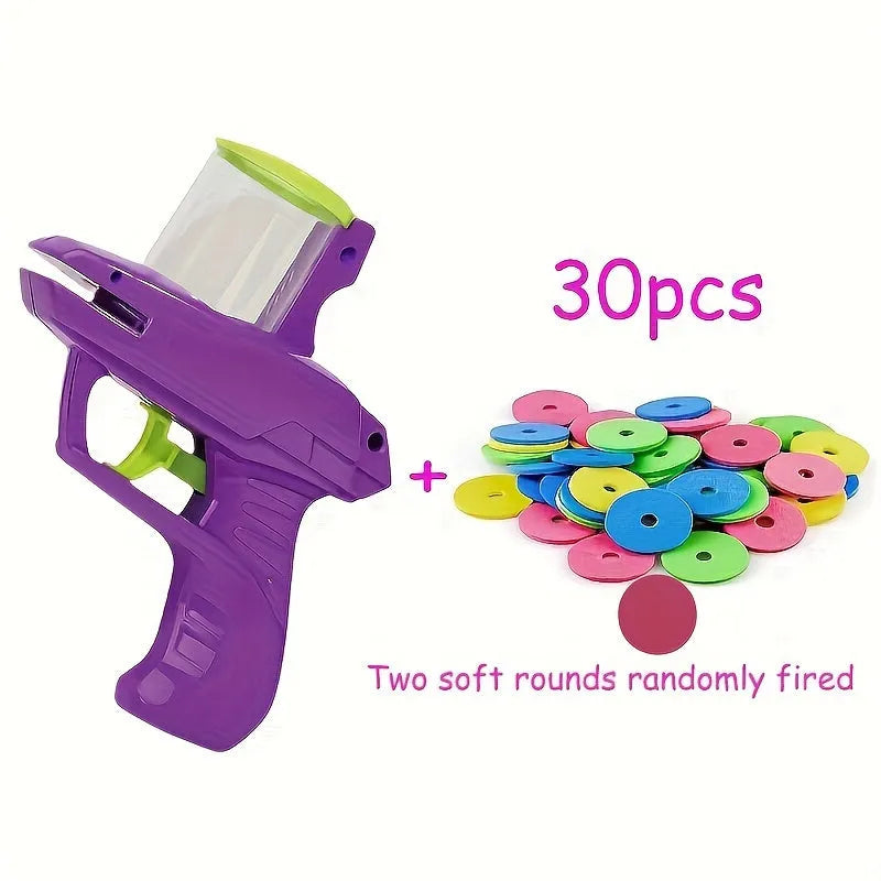 Interactive cat toy launcher firing foam disc with green plastic construction