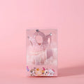 Pet cat wearing a princess crown headdress with a soft pink veil on a fabric headband.