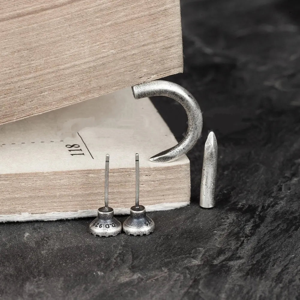 S925 sterling silver punk stud earring in a retro straight or curved nail design on an ear hook.