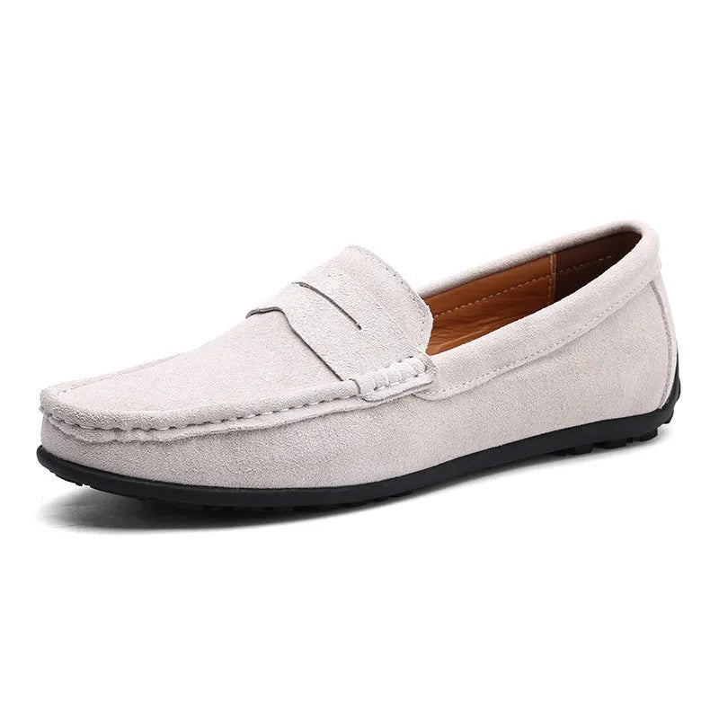 Men's brown suede casual loafers with a round toe and flat rubber sole on a white background.