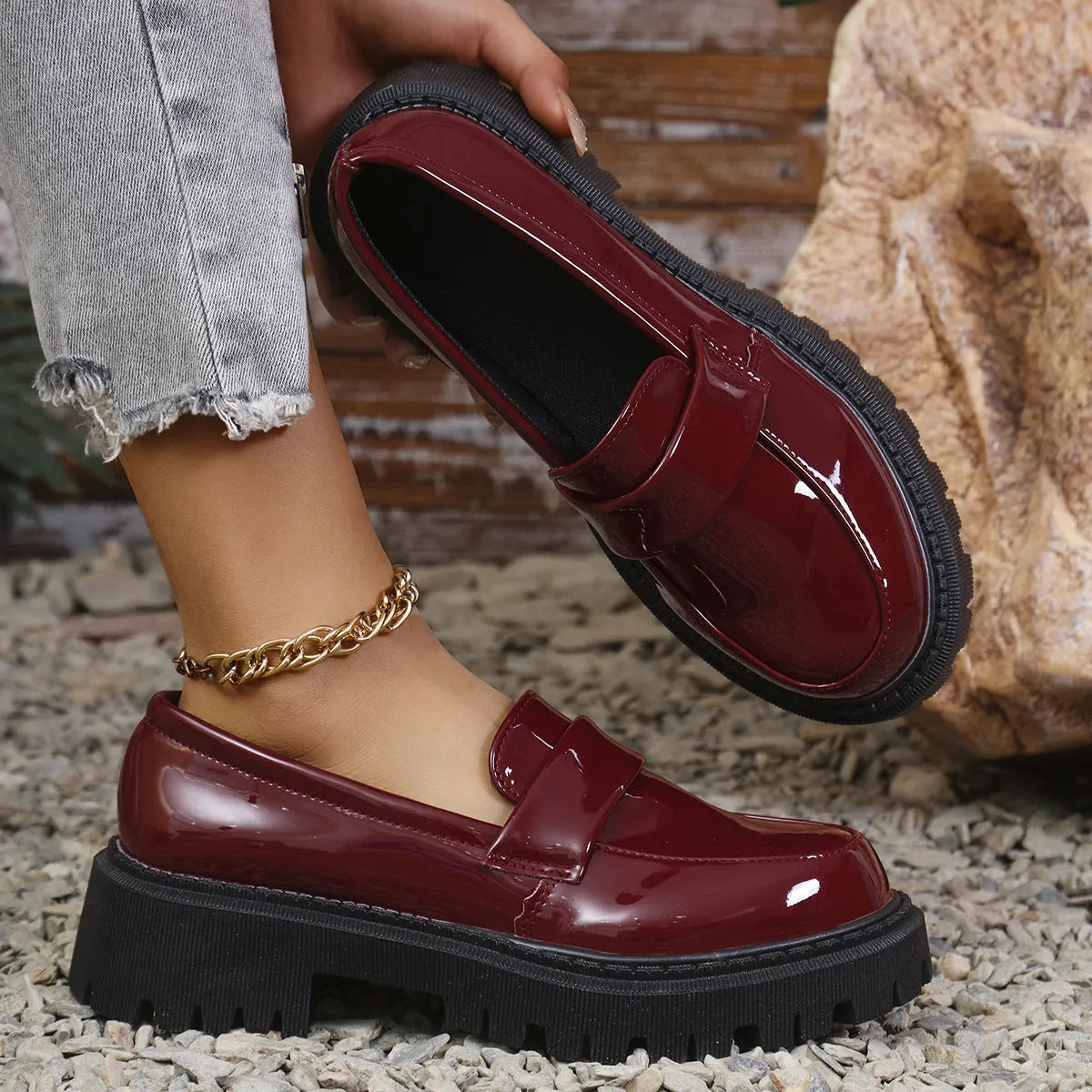 Plus size women's slip-on loafers with a chunky platform heel in black, green, and wine red colours.