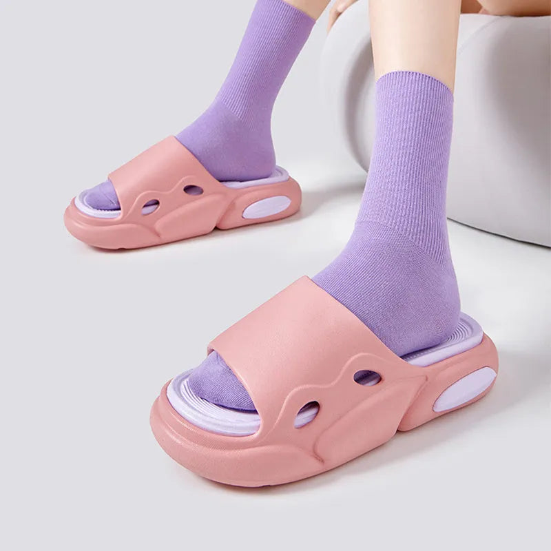 Two-colour EVA slippers for couples with thick sole, shown in pink and purple colour option.