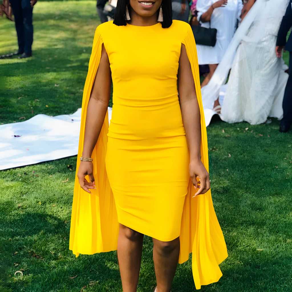Women's yellow long sleeve evening gown with a pleated shawl collar and high waist design