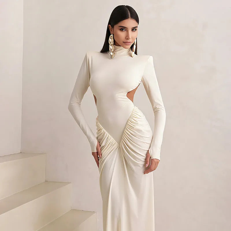 Women's slim fit high collar long sleeve dress with pleated backless detail in light apricot colour.