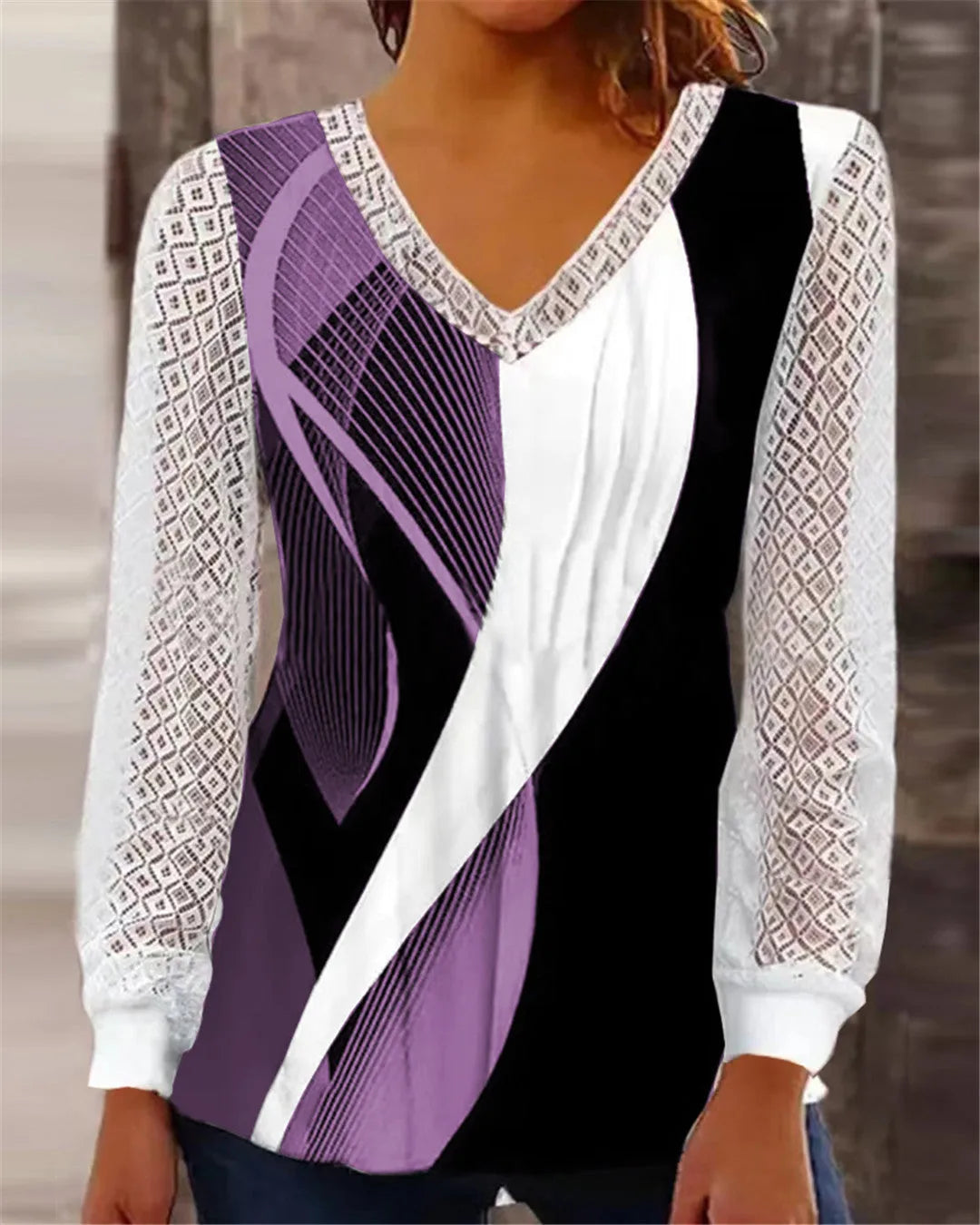 Purple loose V-neck women's top with a white hollow-out lace print pattern and long sleeves.