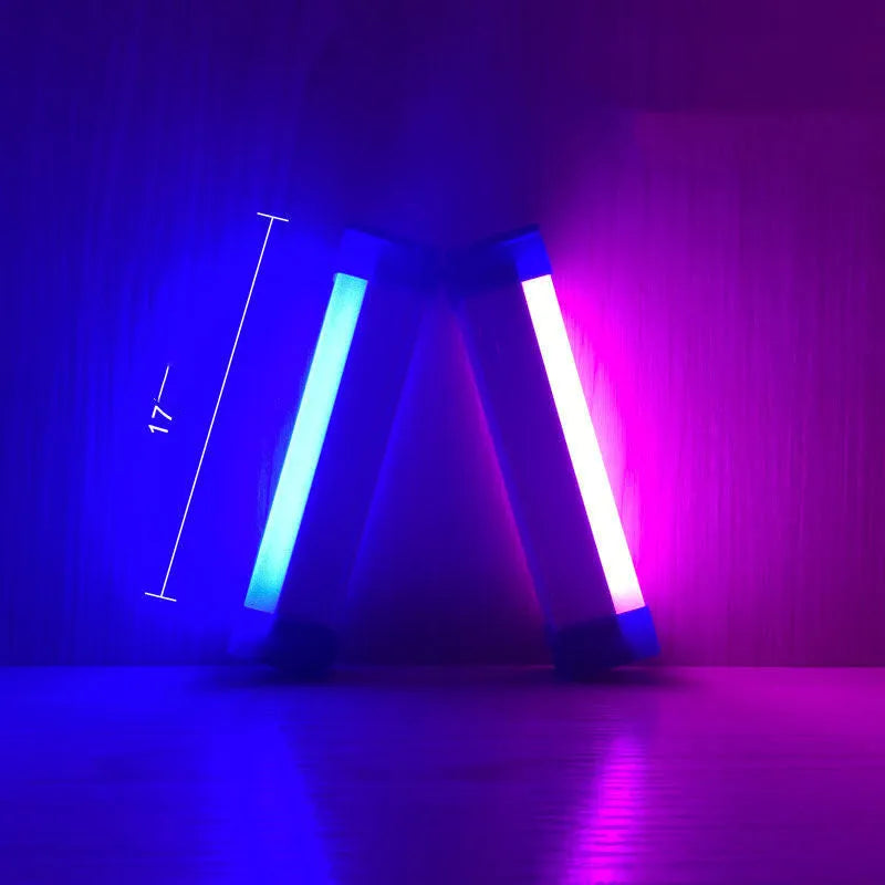 Blue and purple rechargeable LED tube night light with USB cable and dimmable switch.