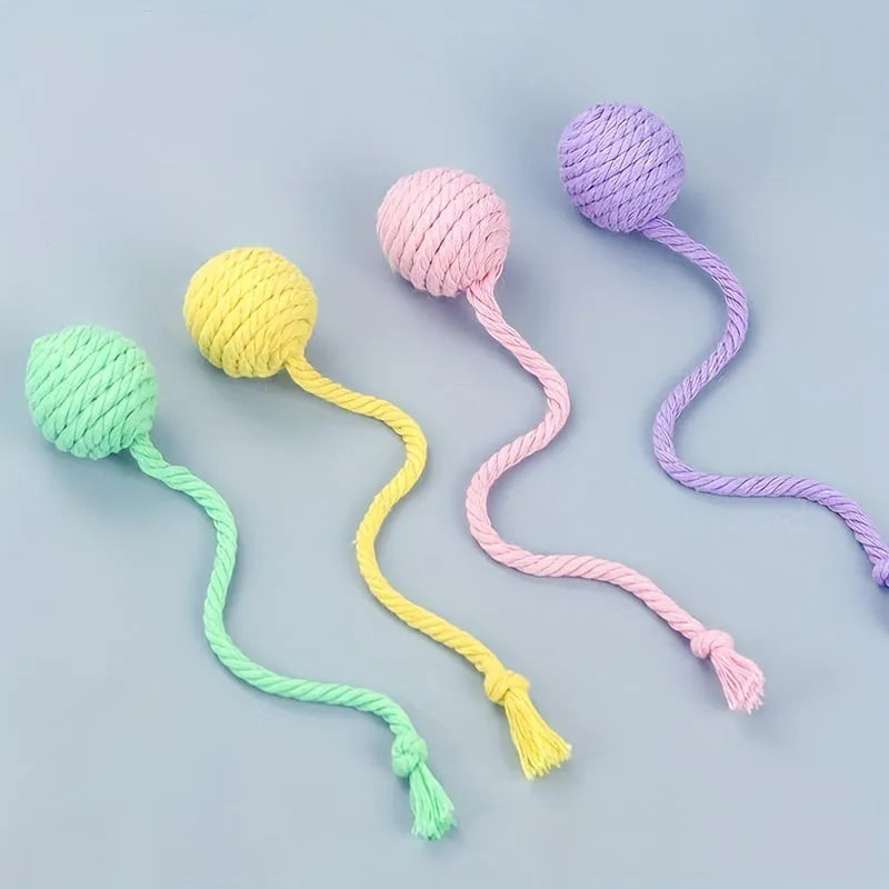 Green and pink soft plush cat toy balls with rope tails and internal bells