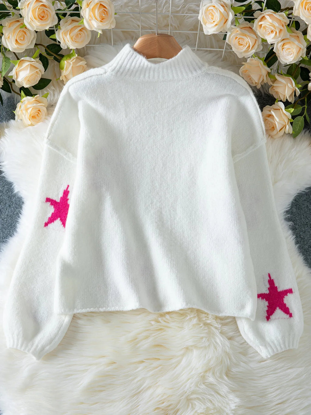 White women's turtleneck pullover with five-pointed star pattern and loose fit design