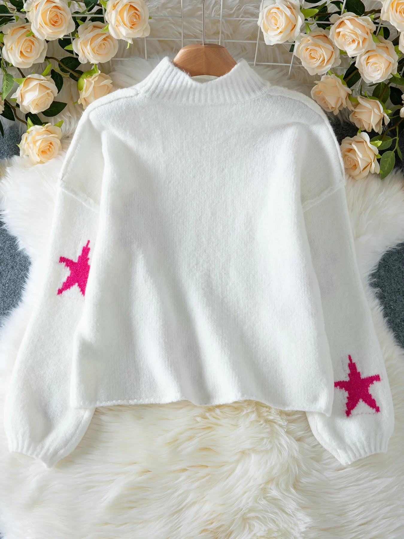 White women's turtleneck pullover with five-pointed star pattern and loose fit design