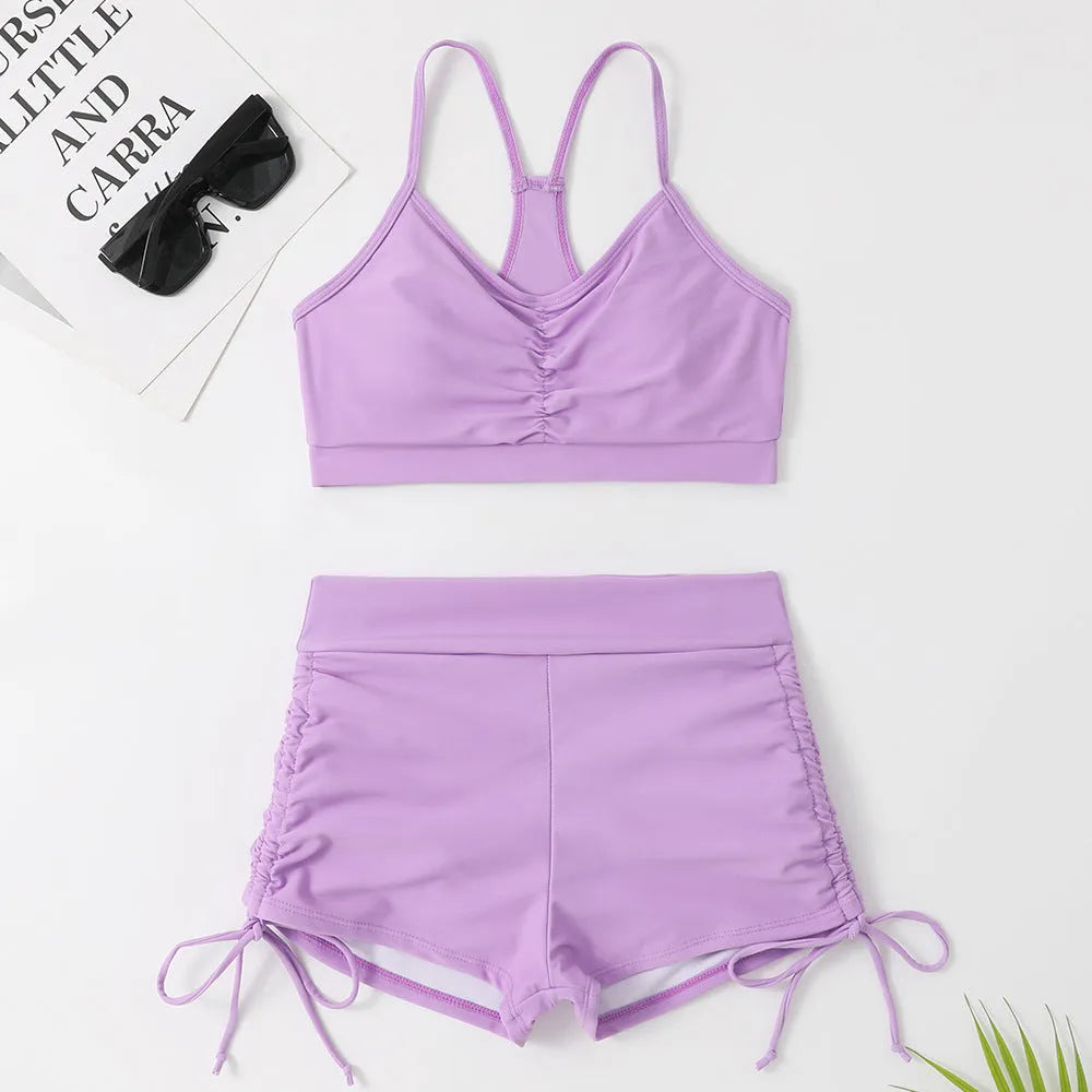 Women's purple high waist split swimsuit with bikini top and shorts