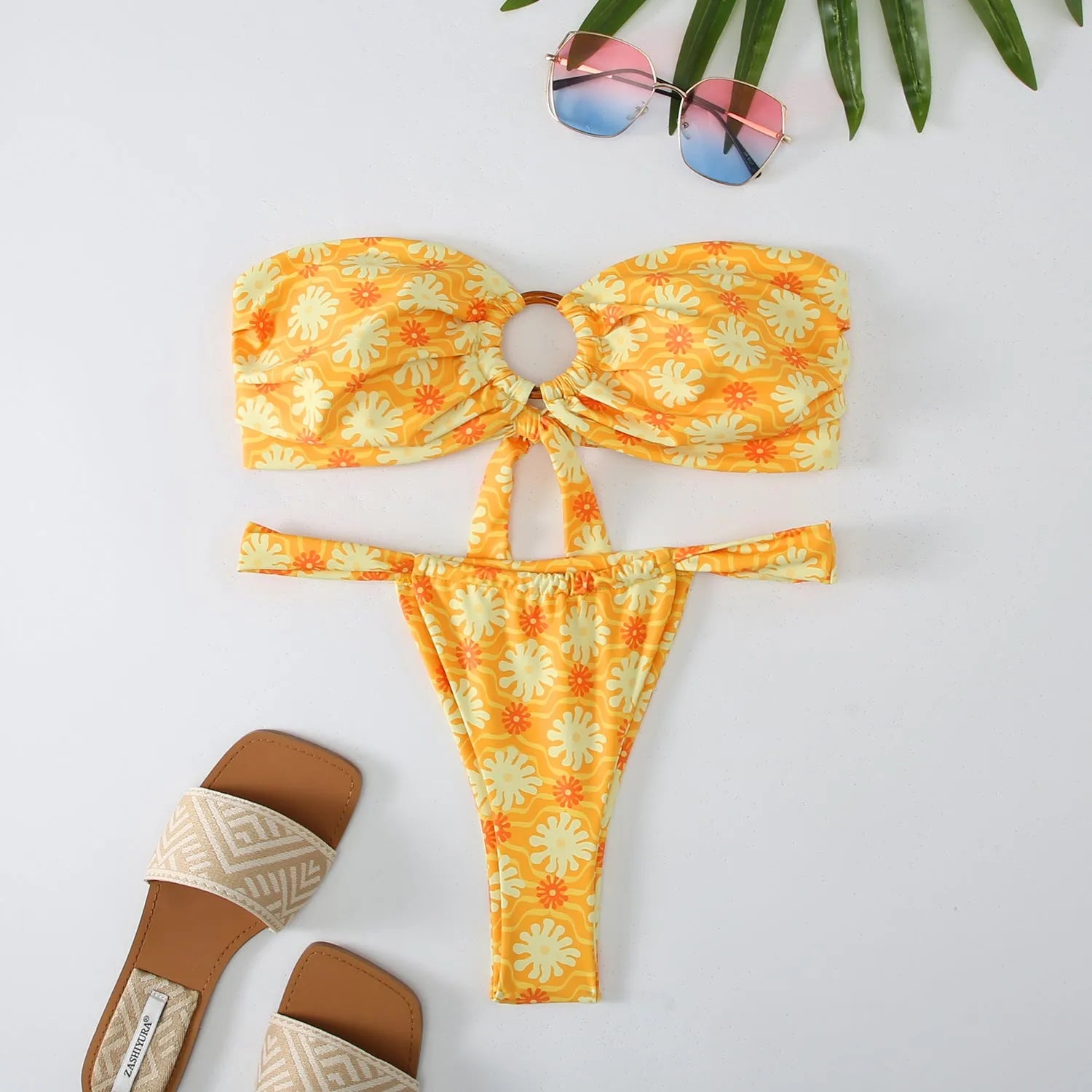Women's floral print tube top ring bikini swimsuit set on mannequin