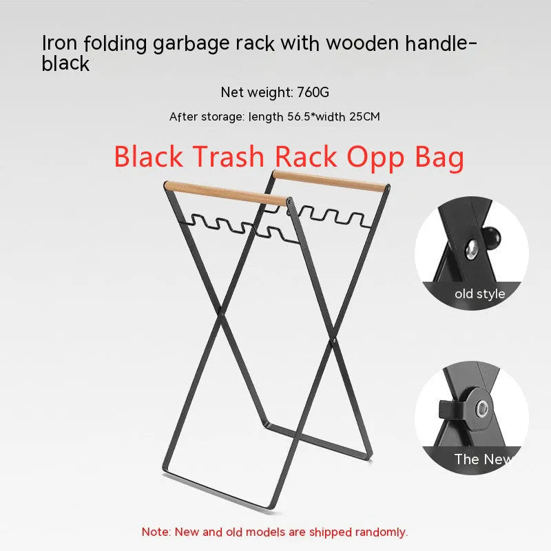 Black folding iron trash rack with wooden handles holding a bin bag outdoors