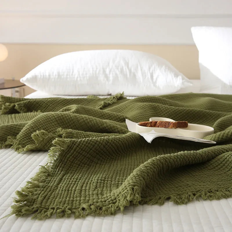 Four-layer gauze cotton blanket with tassel detailing in avocado green colour