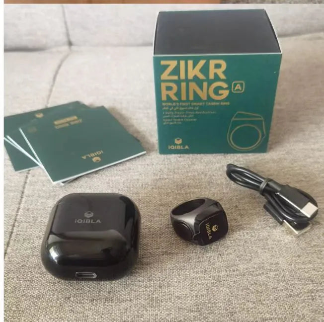 Zikr1 smart ring with OLED display showing prayer times, available in black, green, rose gold, and silver colours