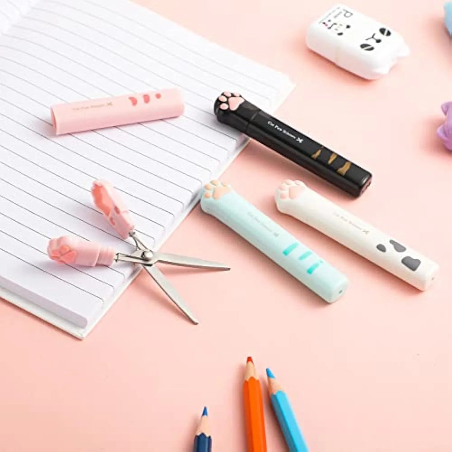 Cat paw mini folding scissors showing stainless steel blades and four colour options: pink, white, black, and blue