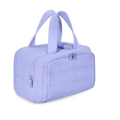 Large lightweight travel toiletry bag in black with wide opening, showing fluffy polyester material.