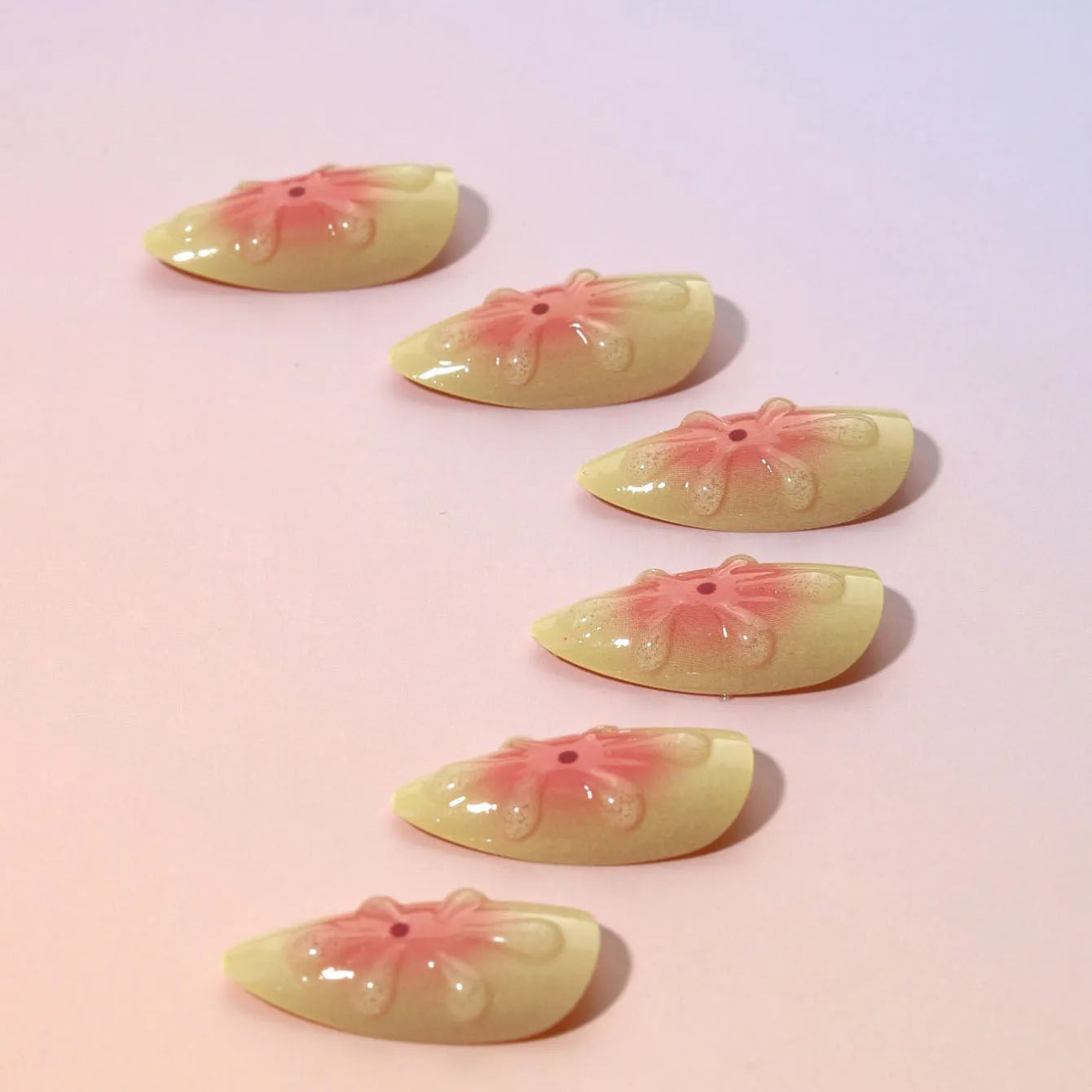 Fake nails with 3D cartoon flower designs on plastic wearable armour pieces in colour TY-318