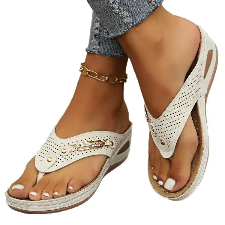 Women's retro flip-flop sandals in cream colour with herringbone detail, shown on a light background.