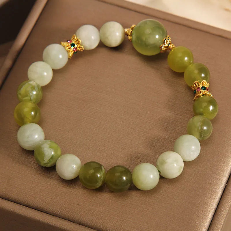 Women's bracelet made of green Xiuyan jade in a light luxury sweet Mori style design.