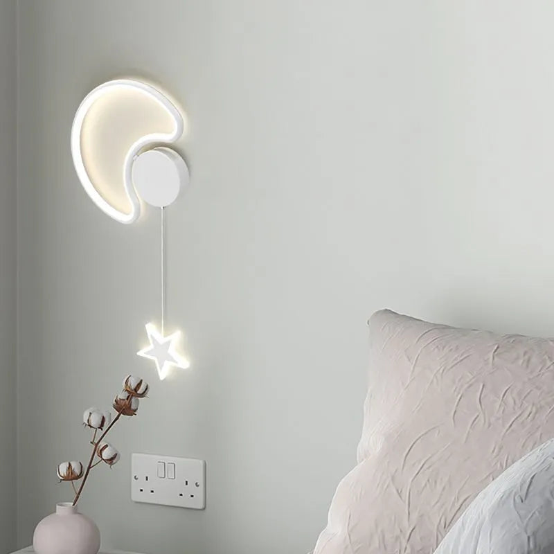 A white cloud-themed children's wall lamp with a left-facing orientation and LED light mounted on a bedroom wall.