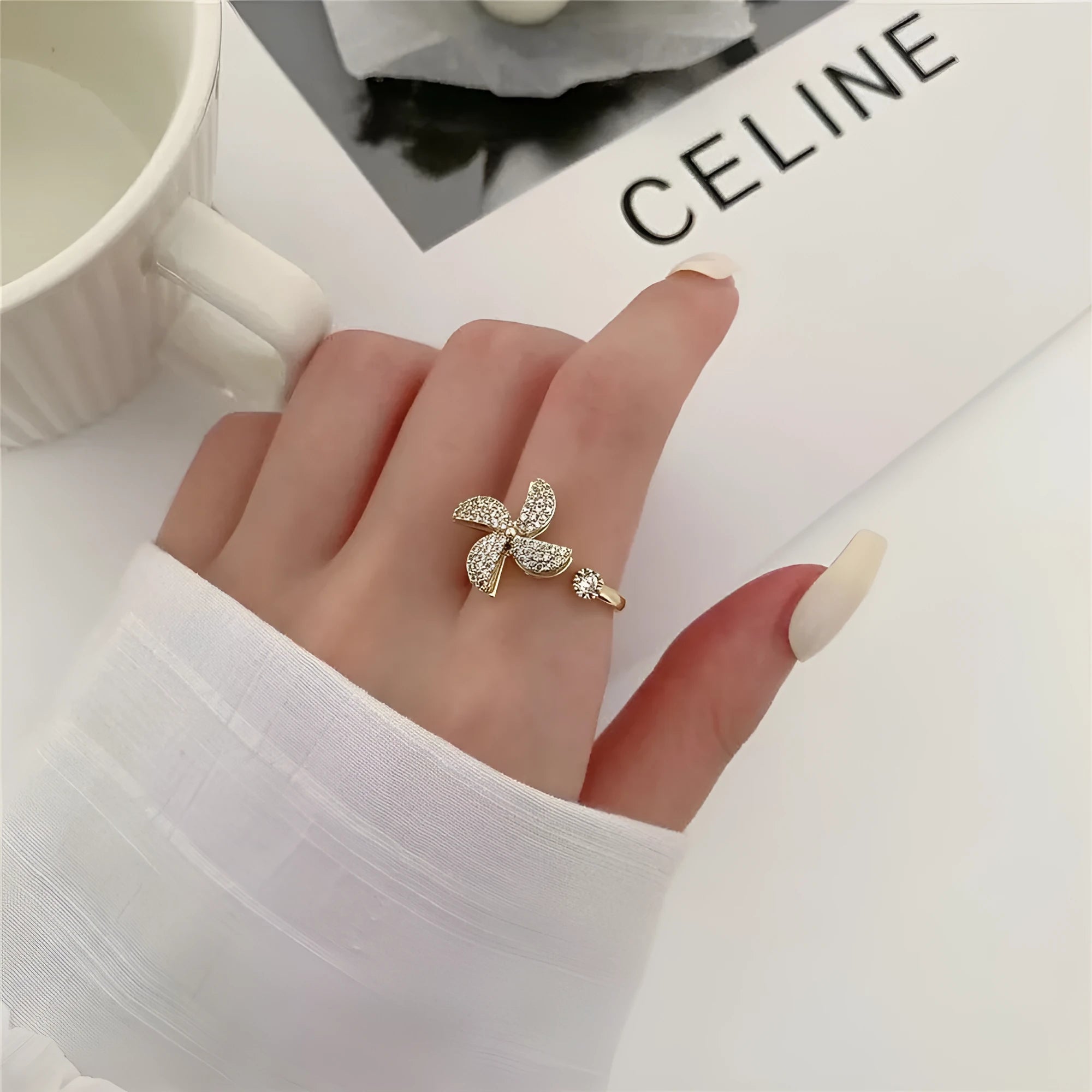 Copper ring with rotating windmill centrepiece in gold or silver finish