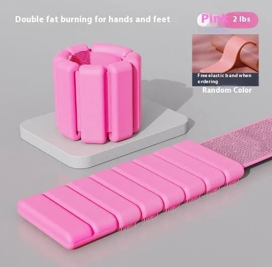 Silicone fitness bracelet with Velcro strap shown in pink, black, grey, and blue colours, with 1lb and 2lb weight options.