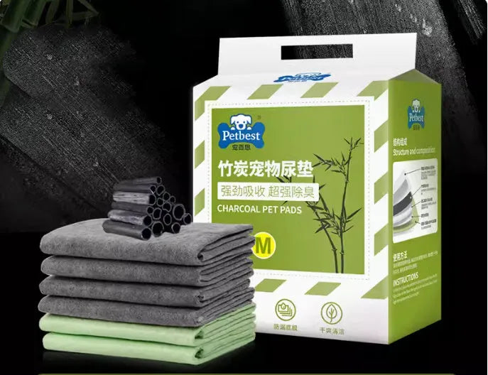 Pack of thickened dog urine pads showing adhesive strips and size comparison between S, M, L, and XL options