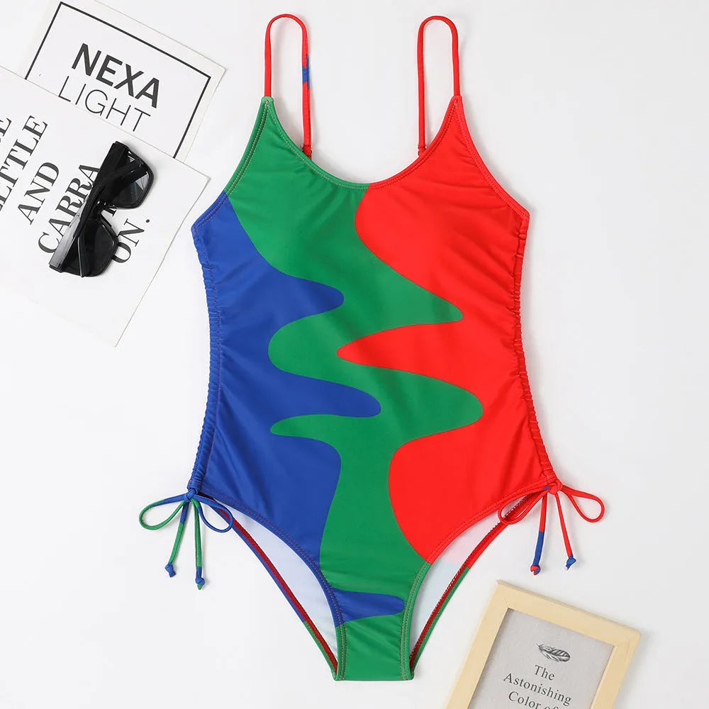 Women's sleeveless backless one-piece swimsuit in blue, shown in a solid colour style.