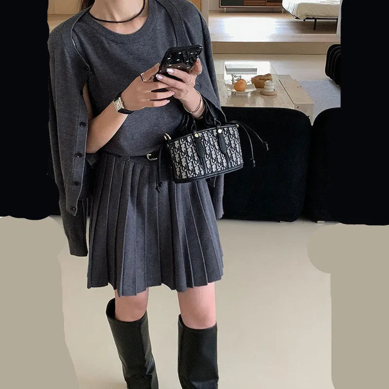 Women's grey national style knitted two-piece set with pleated vest skirt and long-sleeved cardigan.