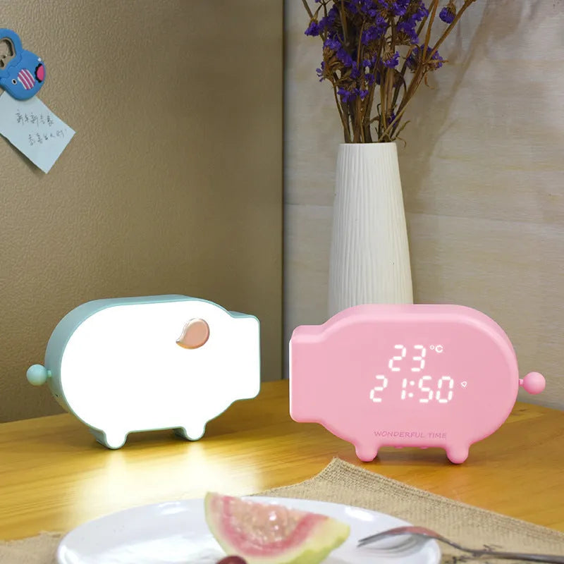 Multifunctional LED alarm clock with temperature display available in blue or pink with USB cable