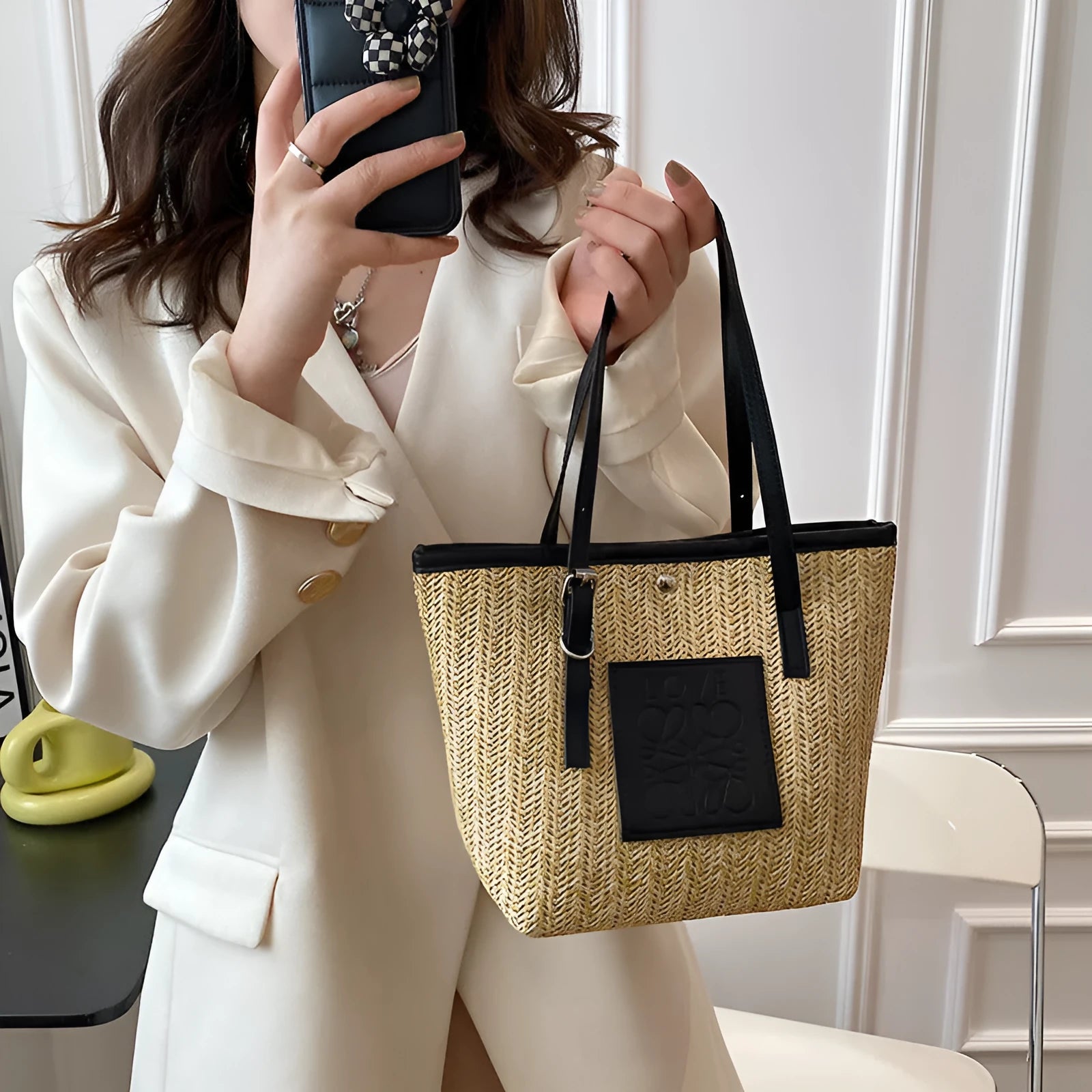 Straw woven women's shoulder bag in black with sewing thread detailing and large capacity design