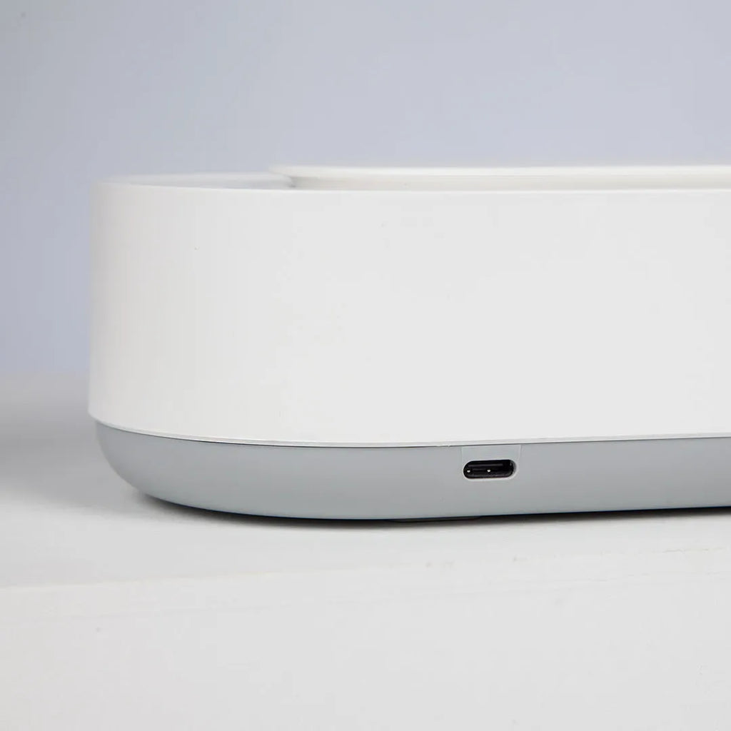 White portable ultrasonic cleaner machine with stainless steel tank for cleaning jewellery and glasses.