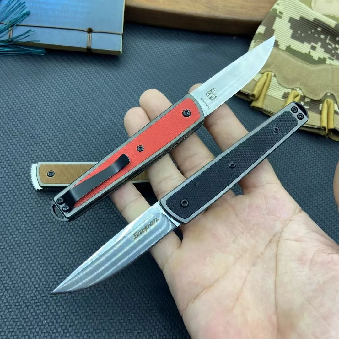 Folding fruit knife with stainless steel blade extended, showing black handle variant with blade measurements