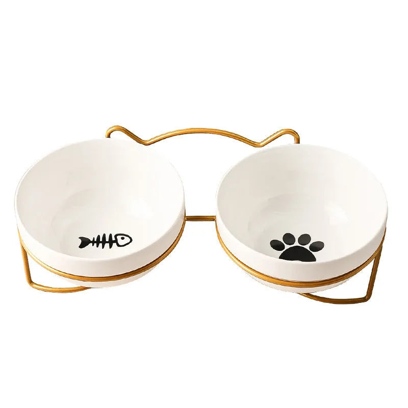 White ceramic cat bowl with cat paw print pattern in a black iron cat-ear frame