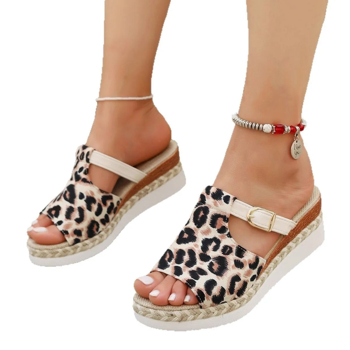 Leopard print wedge platform sandals with a fish mouth toe on a rubber sole.