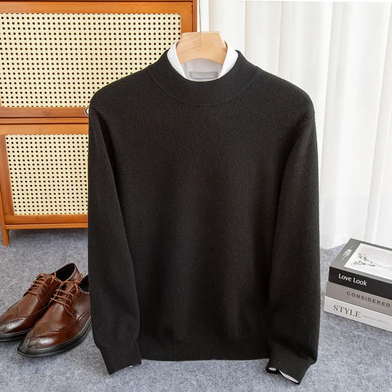 Man wearing a loose-fit half-collar wool sweater in a dark colour, showcasing the knitted texture and neckline design.