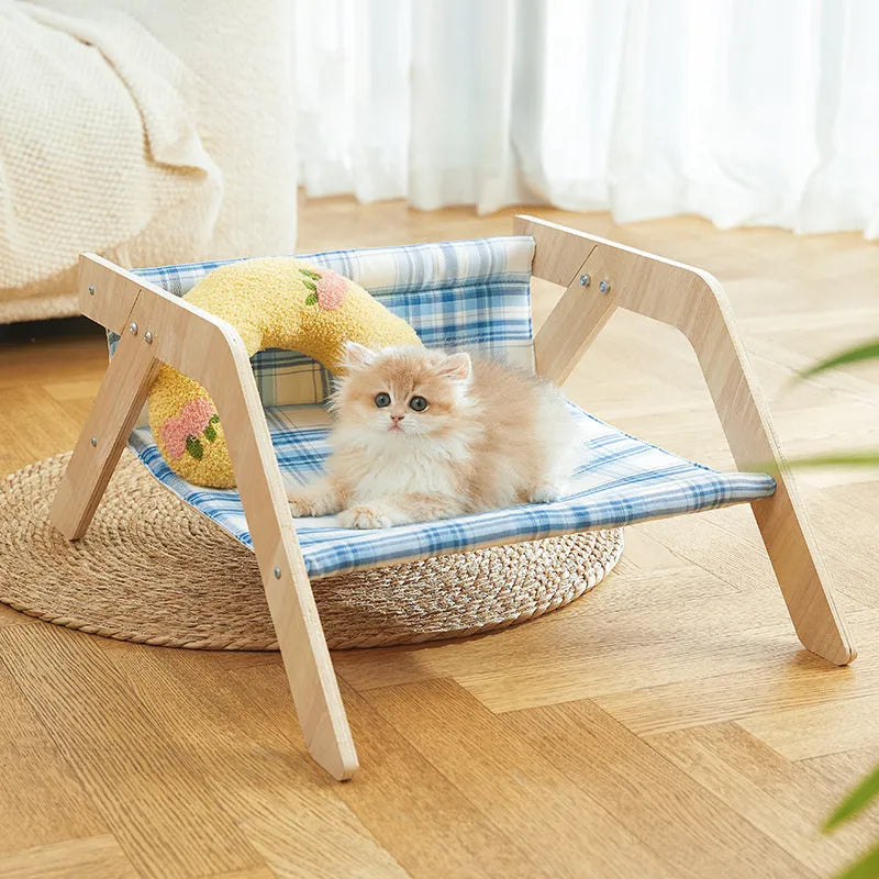 Green wooden elevated cat hammock bed for indoor lounging