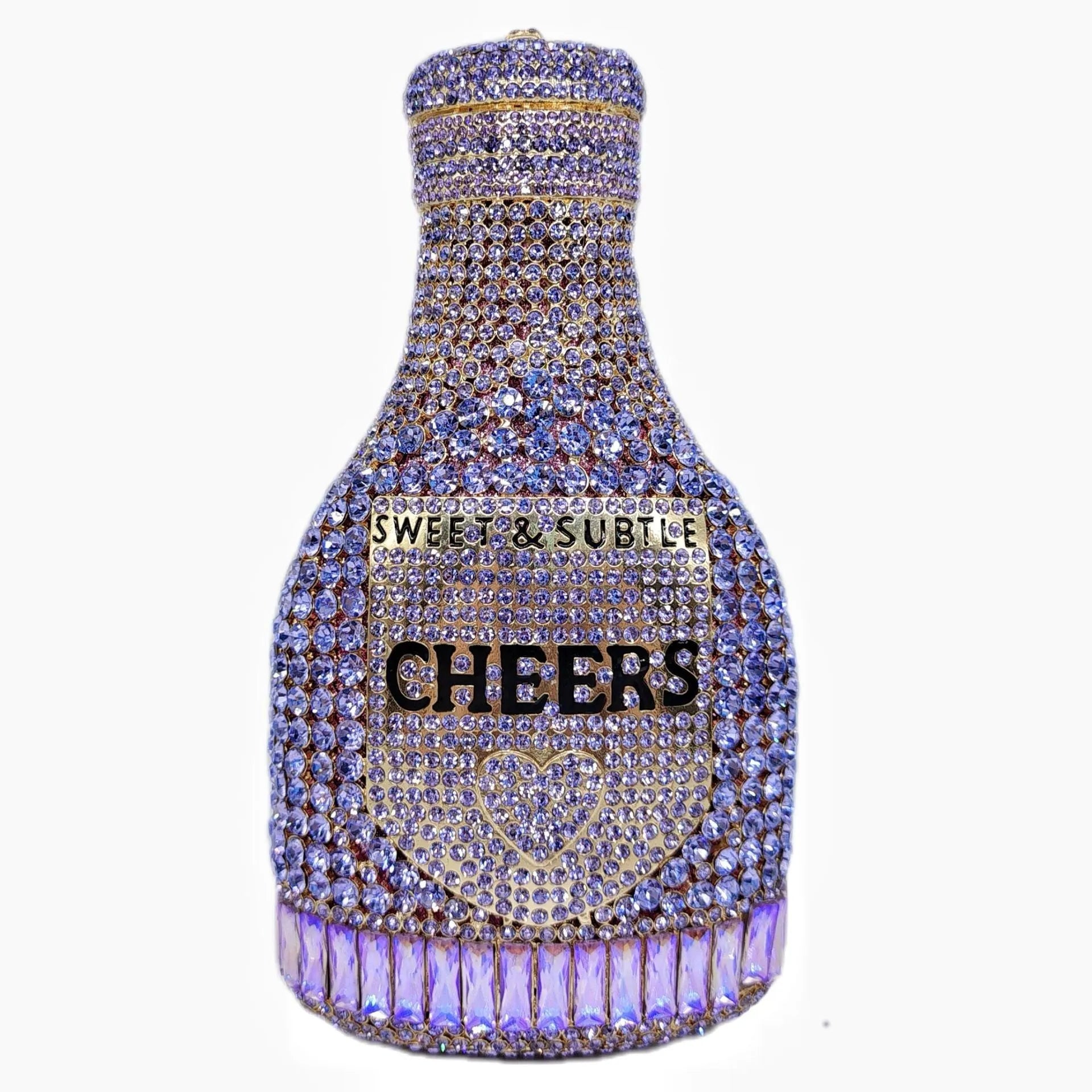 Gold hard-shell champagne bottle shaped evening clutch with rhinestones on a table.