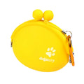 Yellow silicone pouch with hook-and-loop closure for dog treats, shown on a waistband.