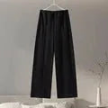 Women's apricot colour polar fleece lounge suit featuring a long sleeve pleated top and wide-leg trousers.