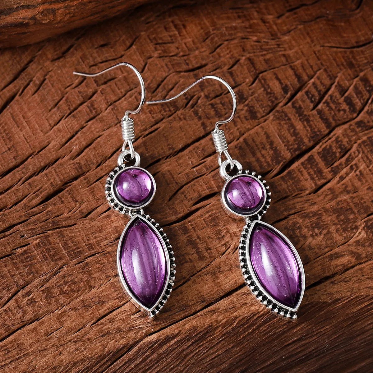 Vintage geometric zinc alloy earrings with electroplated black or purple colour and round pendant elements