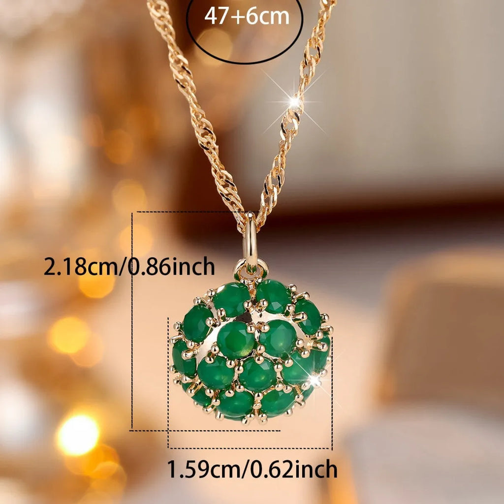 Round emerald and diamond pendant necklace in champagne gold colour on copper chain